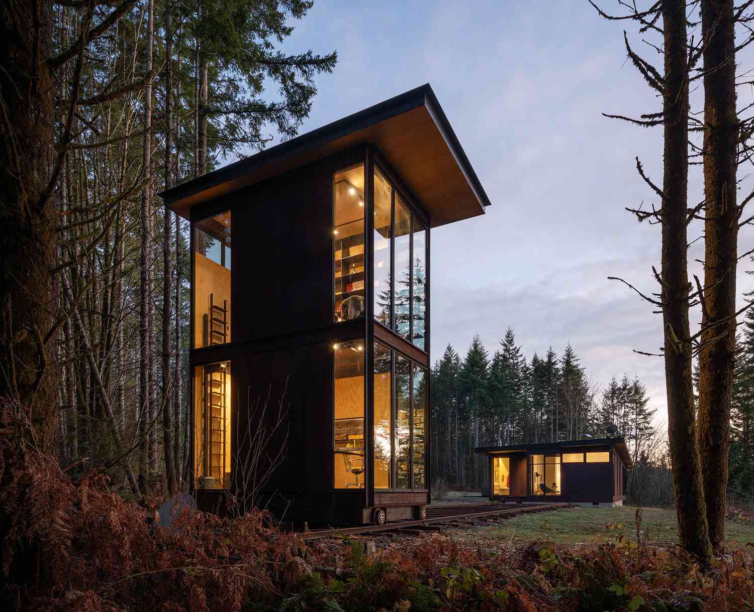 This Ingenious Dwelling Office Rolls Into the Forest on Put together Tracks